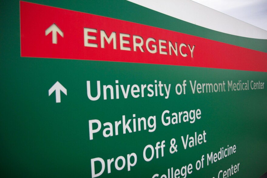 A green and red sign for university of vermont medical center